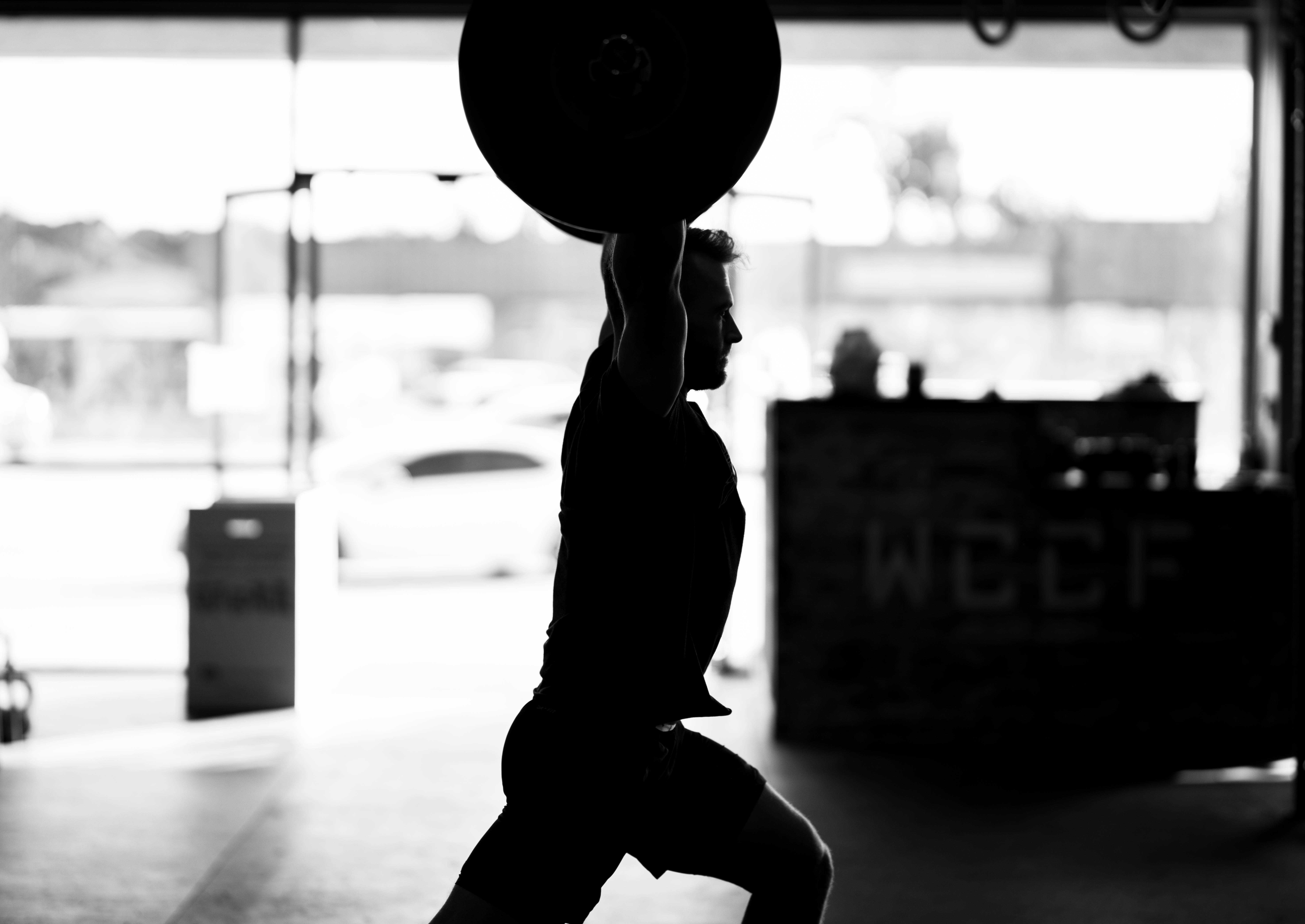 Black and white image of an athlete mid-training, full effort.